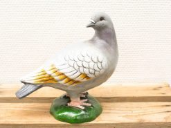 Charming vintage pigeon figurine in detailed gray and white, perfect for home decor.