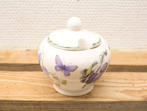 Elegant porcelain sugar bowl with butterfly and floral design, perfect for charming table settings.