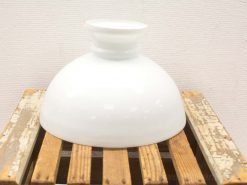 Elegant white porcelain vase with gold accent on rustic wooden pallet. Perfect for home decor.