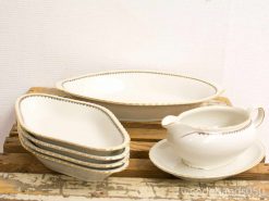 Elegant porcelain dish set with gold rim, perfect for festive gatherings and stylish serving.