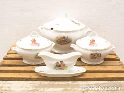 Charming vintage childrens porcelain set with hand-painted whimsical designs for delightful dining.