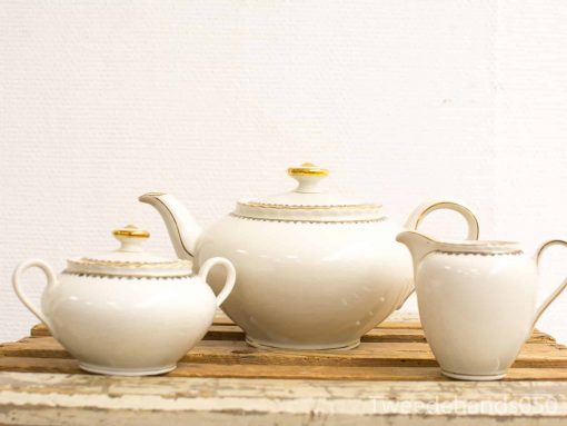 Elegant porcelain tea set with gold accents, perfect for afternoon tea or home decor.