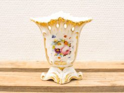 Elegant porcelain vase with hand-painted roses and gold accents, perfect for decorative display.