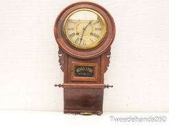 Elegant vintage regulator clock in mahogany with ornate frame and pendulum, perfect for classic decor.