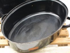 Sleek black oval roasting pan, ideal for versatile cooking and stylish kitchen decor.