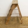 Rustic wooden ladder with character, perfect for practical use or vintage decor.