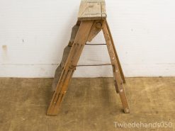 Rustic wooden ladder with character, perfect for practical use or vintage decor.