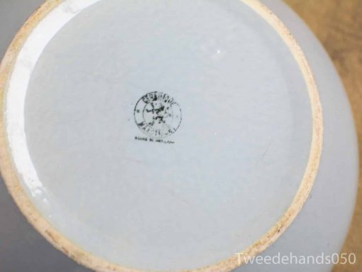 Handcrafted vintage light blue ceramic bowl with unique artisan stamp on the bottom.