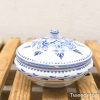 Elegant blue and white ceramic bowl with lid, featuring intricate floral patterns.