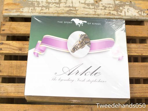 Arkle collectible honors legendary Irish steeplechaser in elegant packaging for horse racing fans.