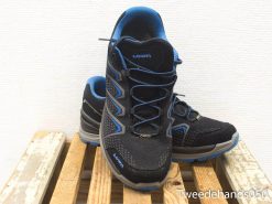 Stylish black trail running shoes with blue accents for comfort and traction on rugged terrains.