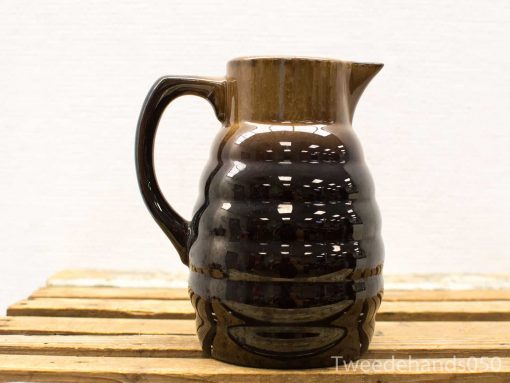 Elegant glossy brown ceramic pitcher, perfect for vintage decor and functional serving.