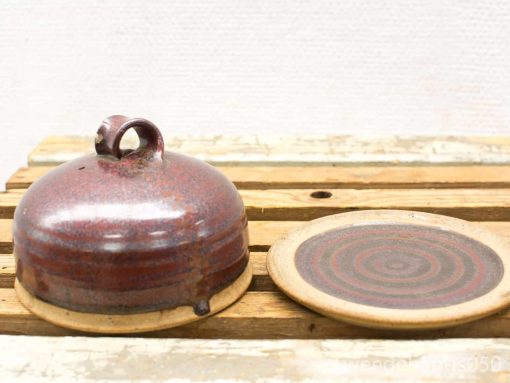 Handmade vintage pottery bowl and plate set with glossy glaze and decorative spiral design.