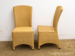 Modern wicker chair set in light beige for elegant indoor and outdoor spaces.