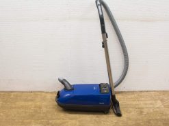 Compact blue vacuum cleaner with user-friendly controls and a flexible hose for easy maneuverability.