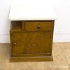 Elegant vintage bedside table with marble top and warm wooden finish, perfect for any decor.