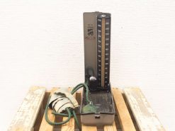 Vintage 1950s blood pressure meter, retro medical device with chrome dial and flexible tubing.