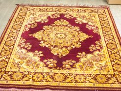 Burgundy vintage area rug with intricate floral and geometric patterns for elegant decor.