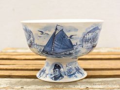 Vintage ceramic bowl with sailboat illustrations, perfect for nautical decor or everyday use.