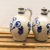 Vintage ceramic jugs with intricate blue designs, perfect for décor or practical use.