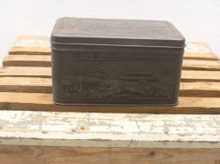 Antique engraved tin box featuring a serene landscape, perfect for decor or storage.