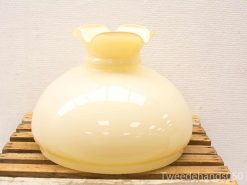 Charming vintage yellow vase with scalloped rim, perfect for decor or floral arrangements.