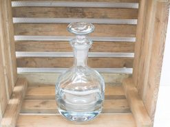 Elegant vintage glass decanter for whiskey, showcasing refinement and rustic charm in your bar.