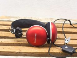 Vintage GRUNDIG headphones in glossy red with large ear cups and adjustable headband.