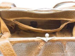 Chic vintage light brown leather handbag with compartments and soft beige lining, perfect for essentials.