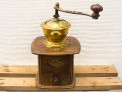 Antique wooden coffee grinder with brass bowl, perfect for traditional coffee lovers and decor.