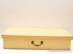 Charming vintage wooden storage box, pale yellow, rustic patina, perfect for organizing keepsakes.