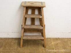 Rustic wooden ladder with four steps, perfect for decor and adding vintage charm.