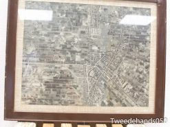 Vintage aerial map showcasing fields, roads, and community areas in historical gray and brown tones.