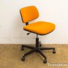 Vibrant orange office chair with adjustable height, ideal for a stylish and functional workspace.