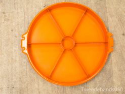 Vibrant orange serving tray with handles, perfect for snacks and entertaining indoors or outdoors.