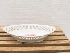 Elegant vintage porcelain dish with floral design, perfect for serving and decoration.