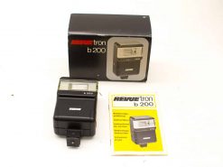 Vintage Revue Tronn B 200 flash unit with original packaging and instruction manual.