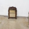 Elegant vintage mirror with ornate wooden frame, adding charm and character to any space.