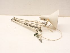 Vintage adjustable desk lamp with white shade, exuding retro charm and character.