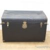 Charming vintage black trunk perfect for storage and adding character to any space.