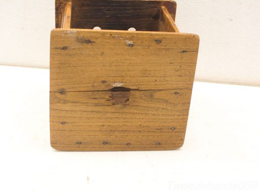 Rustic wooden box with history, showcasing craftsmanship and unique character for vintage decor lovers.