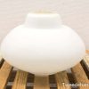 Elegant white ceramic bowl with glossy finish and stylish rounded shape for serving or decoration.