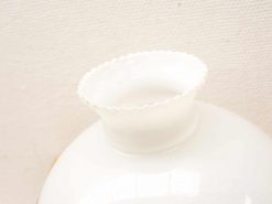 Elegant white ceramic vase with scalloped rim, perfect for flowers or decorative display.