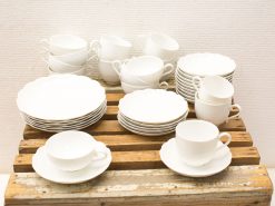 Elegant white vintage china set for special occasions, adding charm to any table setting.