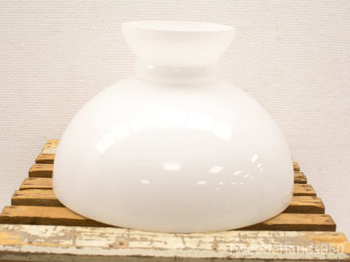 Stylish white glass lamp with rustic wooden base, perfect for enhancing any interior decor.