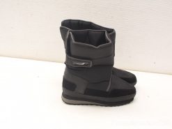 Stylish black vintage boots with adjustable strap, perfect for comfort and outdoor versatility.