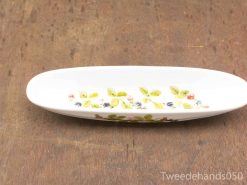 Elegant porcelain dish with floral design, perfect for serving or as a decorative accent.