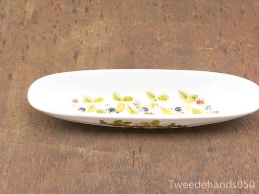 Elegant porcelain dish with floral design, perfect for serving or as a decorative accent.