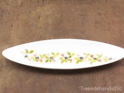 Elegant porcelain serving platter with floral design, perfect for any dining occasion.