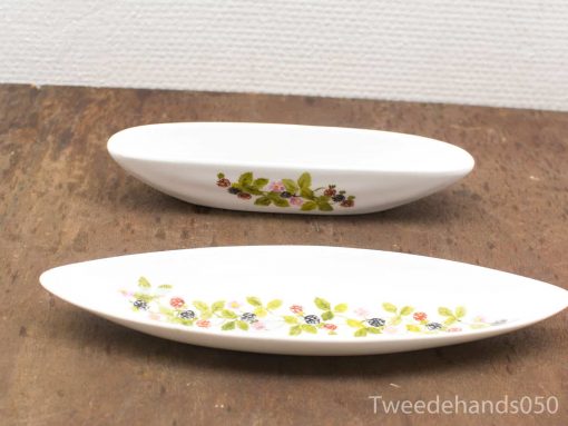 Elegant porcelain serving dishes with botanical designs, perfect for appetizers and salads.